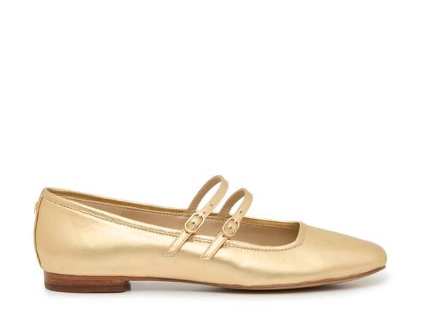 Featuring a gold Mary Jane shoe.