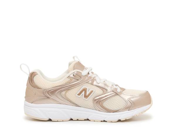 Featuring a metallic gold sneaker from New Balance.