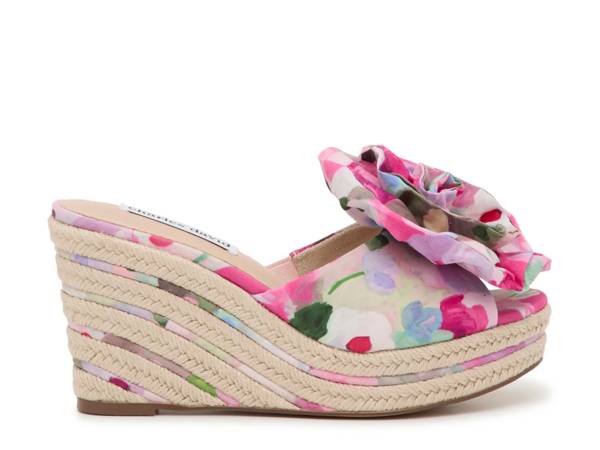 Featuring a floral wedge sandal.