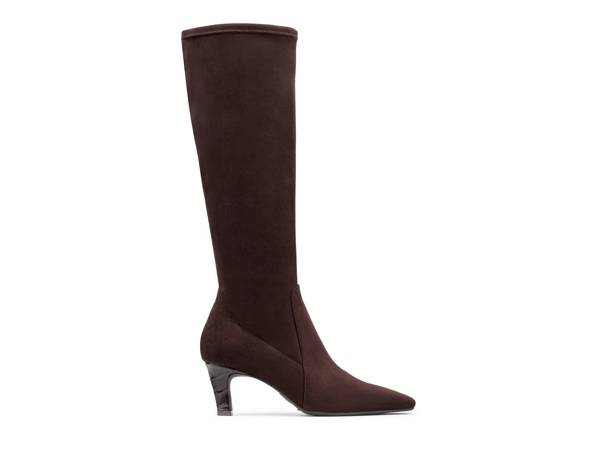 Featuring a tall brown suede boot.