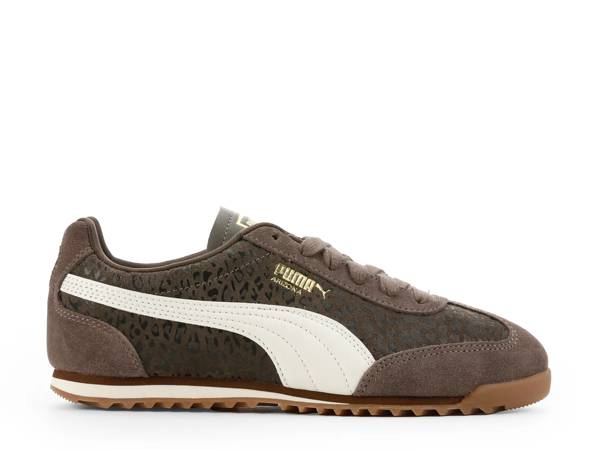Featuring a brown court sneaker.