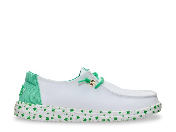 Featuring a green HEYDUDE slip on.