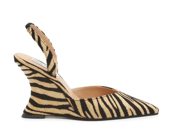 Featuring a zebra print wedged pump from Steve Madden.