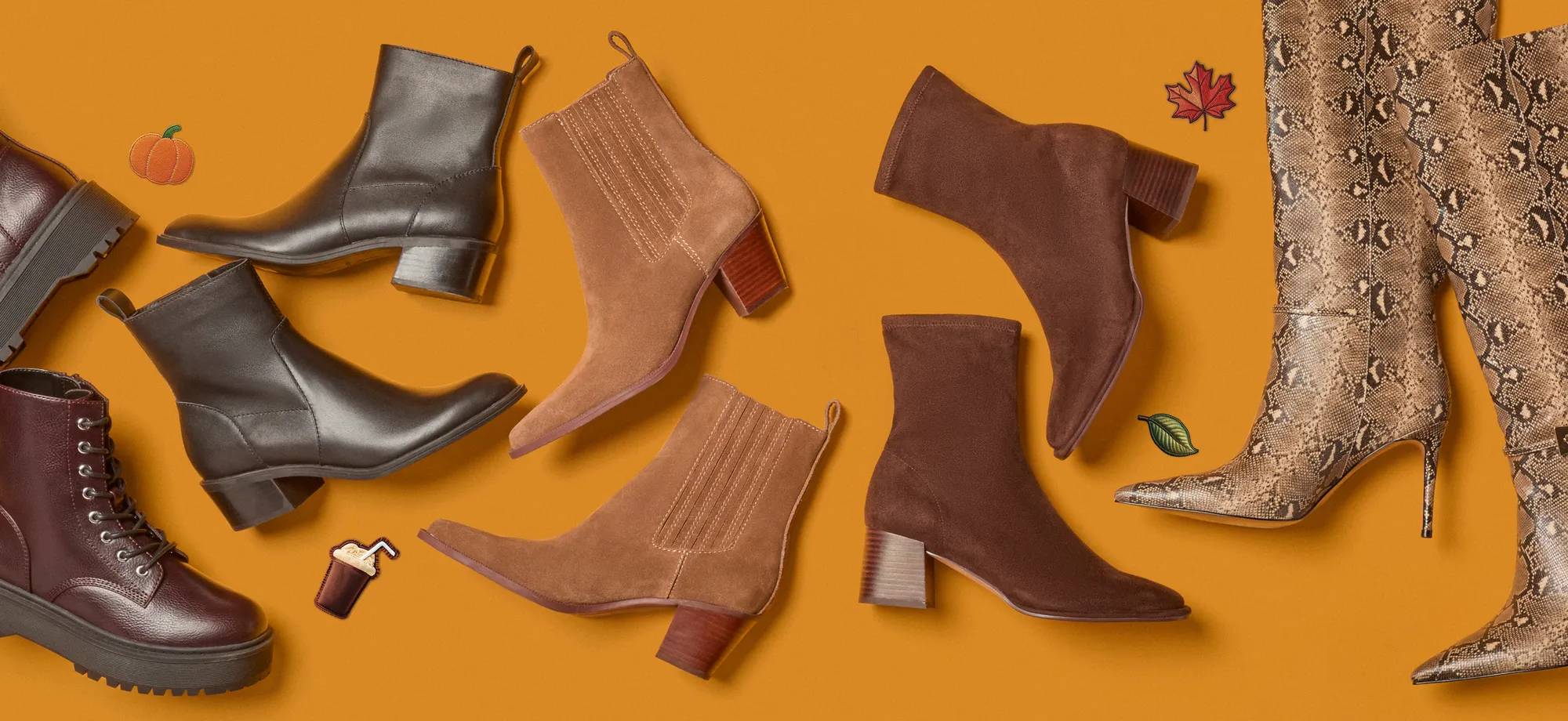 Fall booties laid on an orange background with fall emojis surrounding it