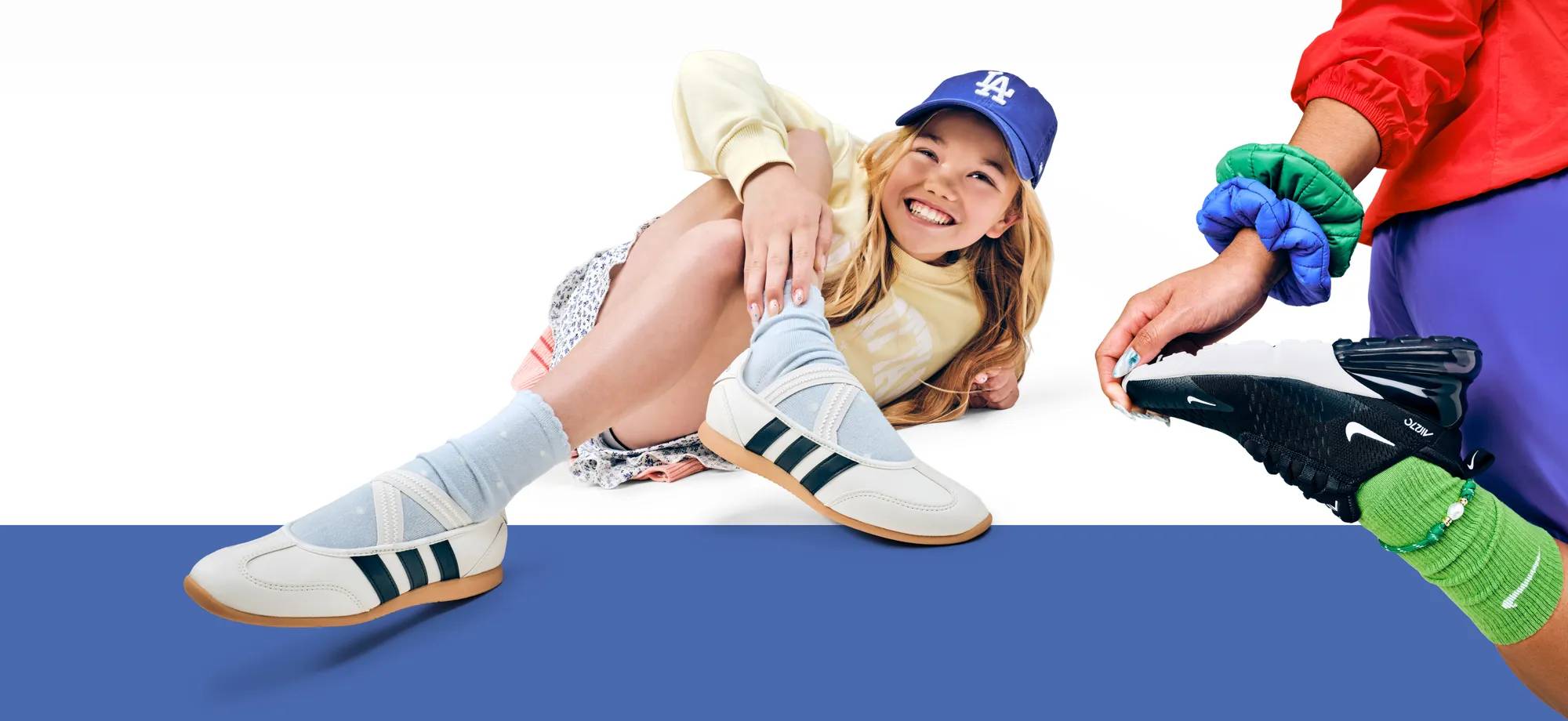 Girl wearing white adidas ballet sneakers