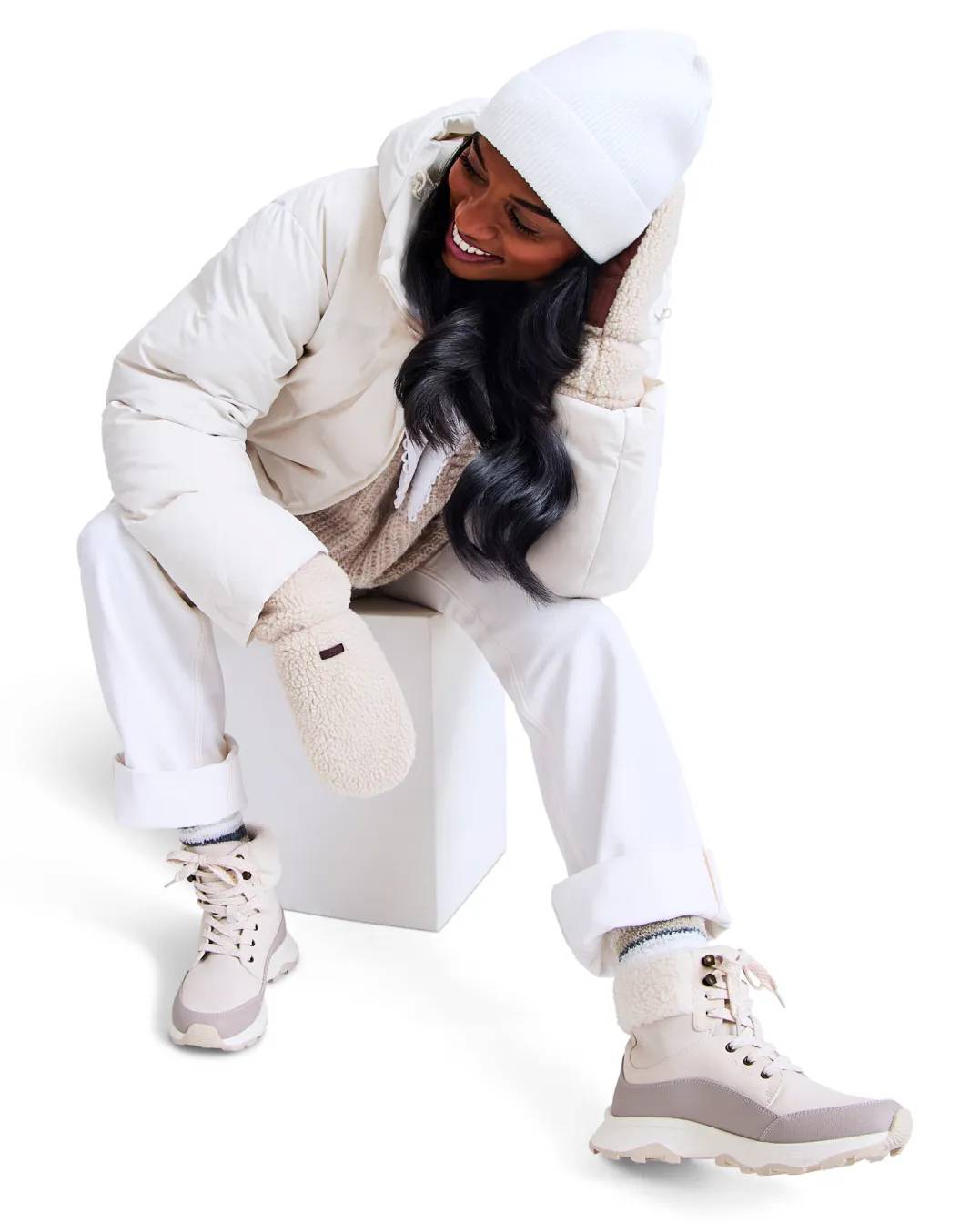 Shop snow and winter boots | woman wearing white snow boots