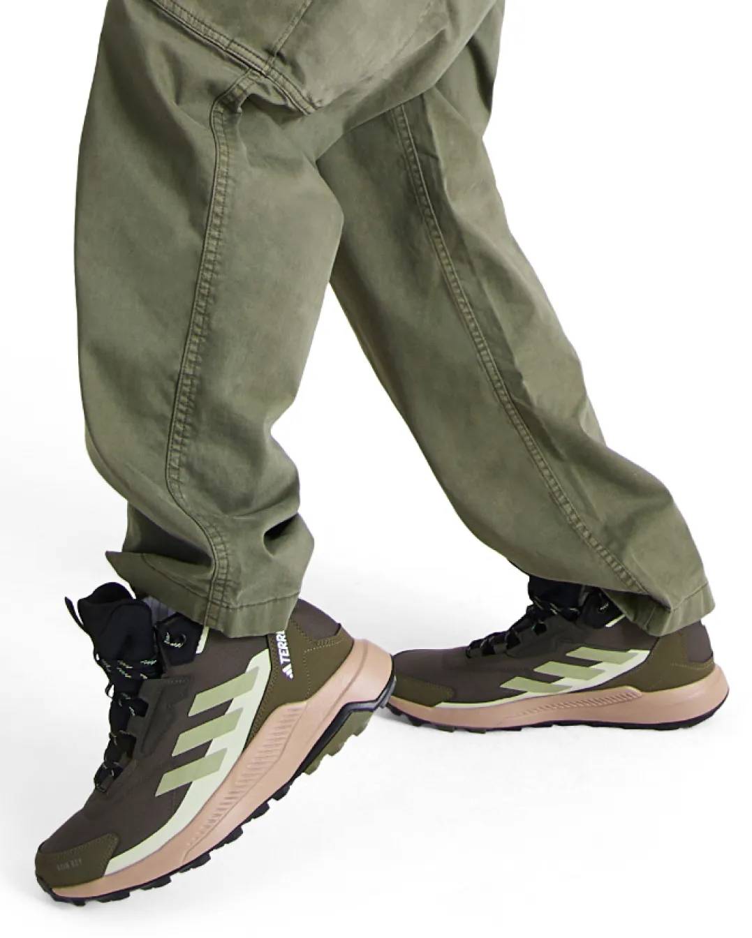 Shop hiking boots | a man wearing green hiking boots