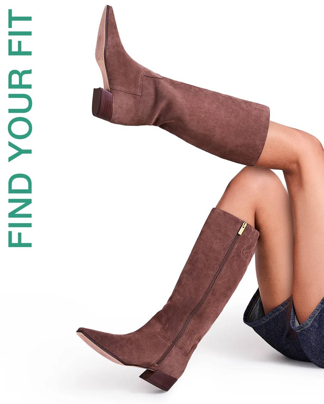 Model wearing brown tall boots