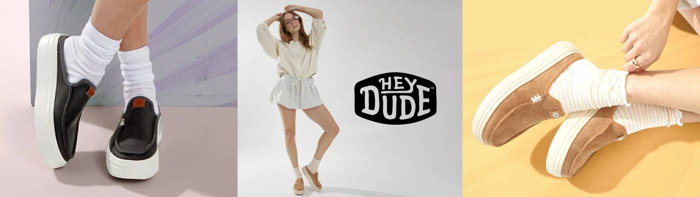 Models wear casual outfits like sweatshirts and skirts or shorts while showcasing beige and brown Hey Dude slip-on shoes; one close-up shows cozy brown canvas sneakers paired with socks, all presented in playful, pastel studio settings.