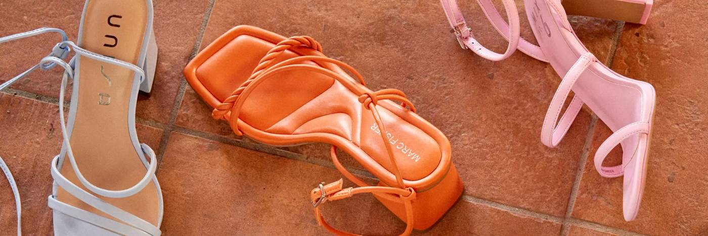 Various women's heels on tile