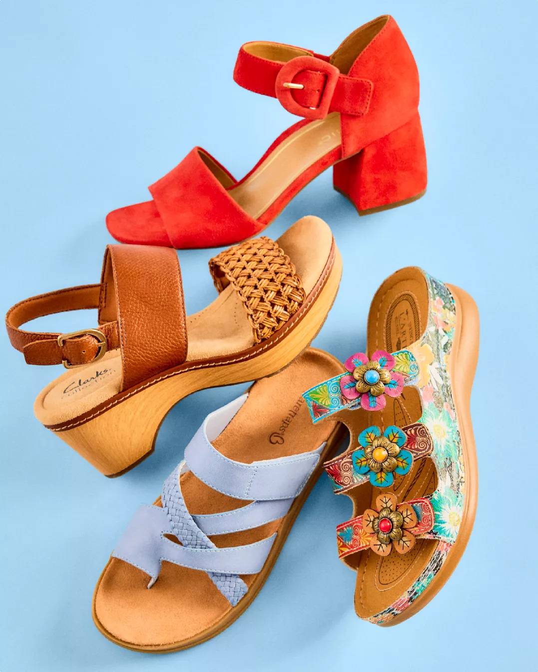 Various colorful wedge sandals on a blue background
