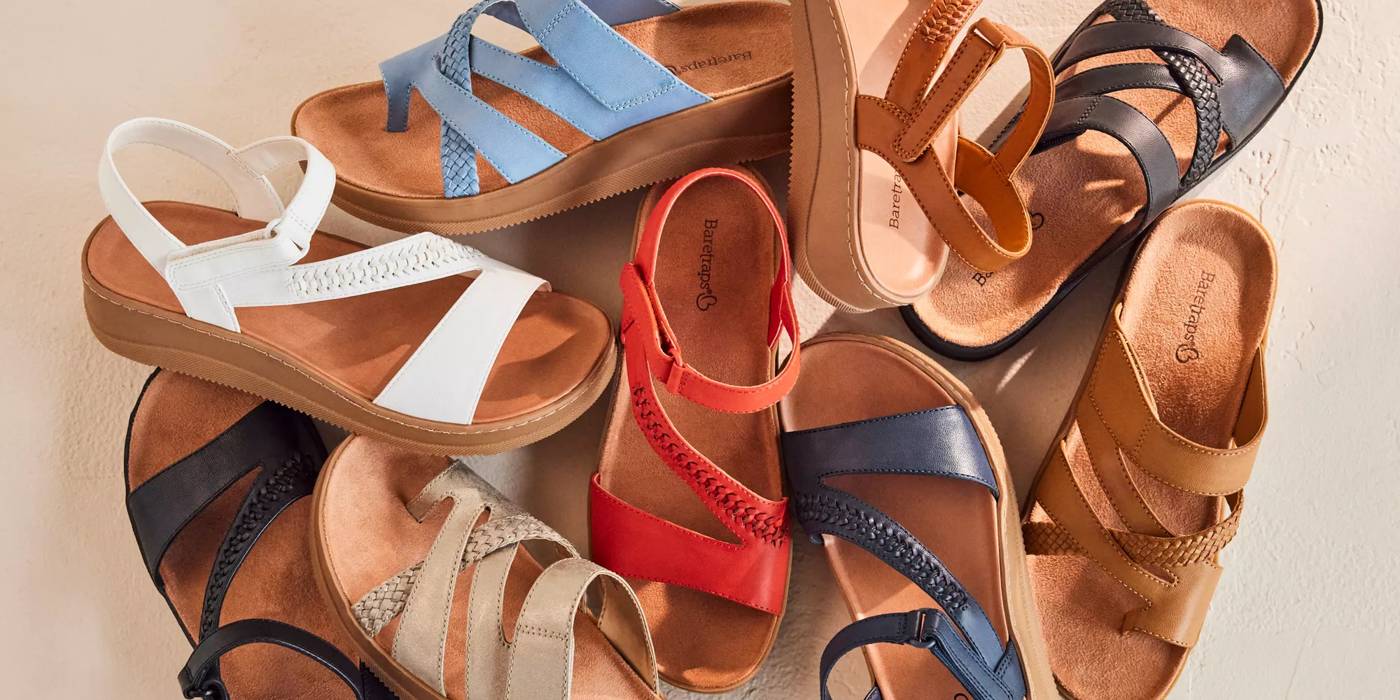Various color sandals on a neutral background