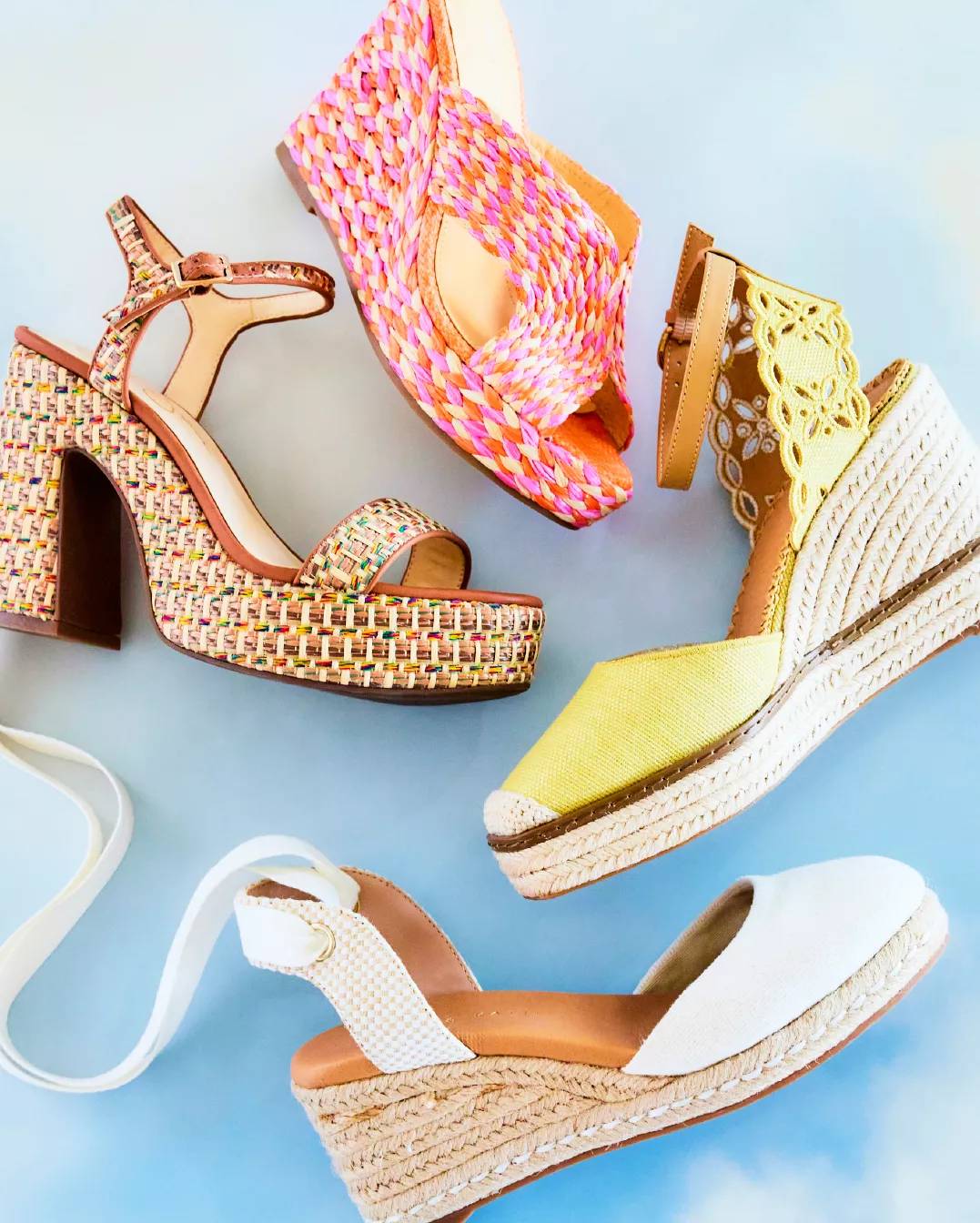 Various wedge sandals on a blue background