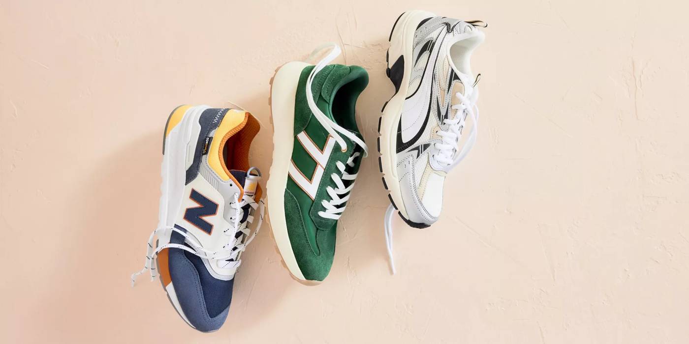 Three men's fashion sneakers on a white background