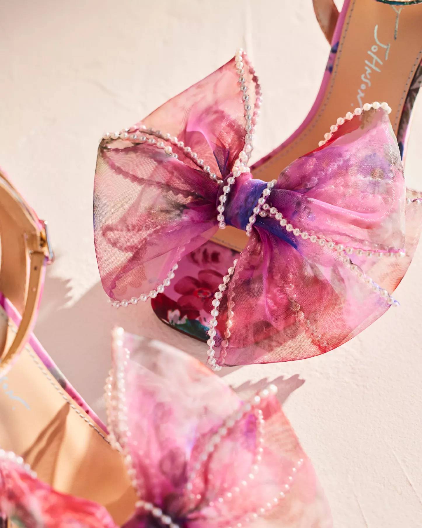 A pair of pink and purple statement heels