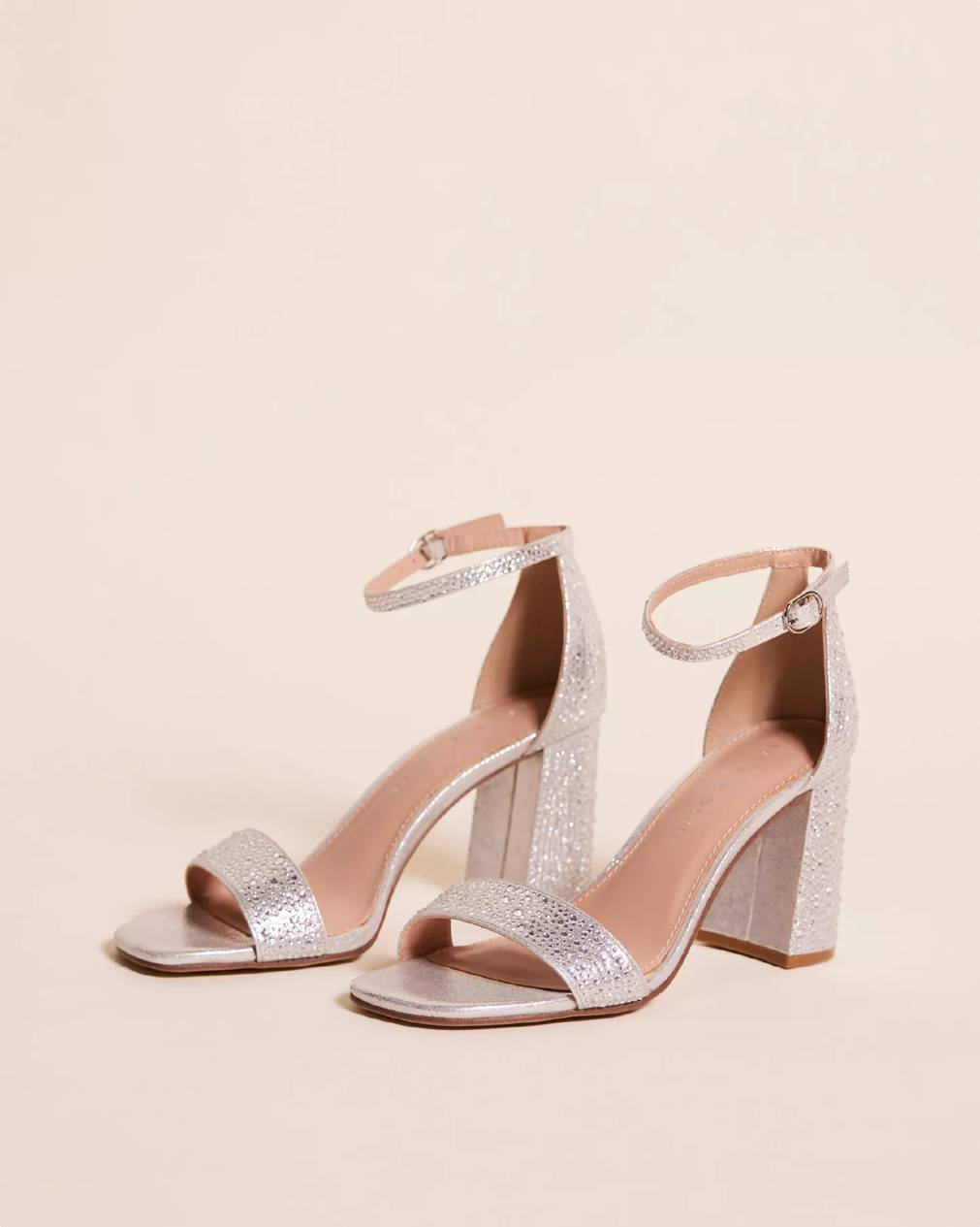 A pair of sparkly block sandals