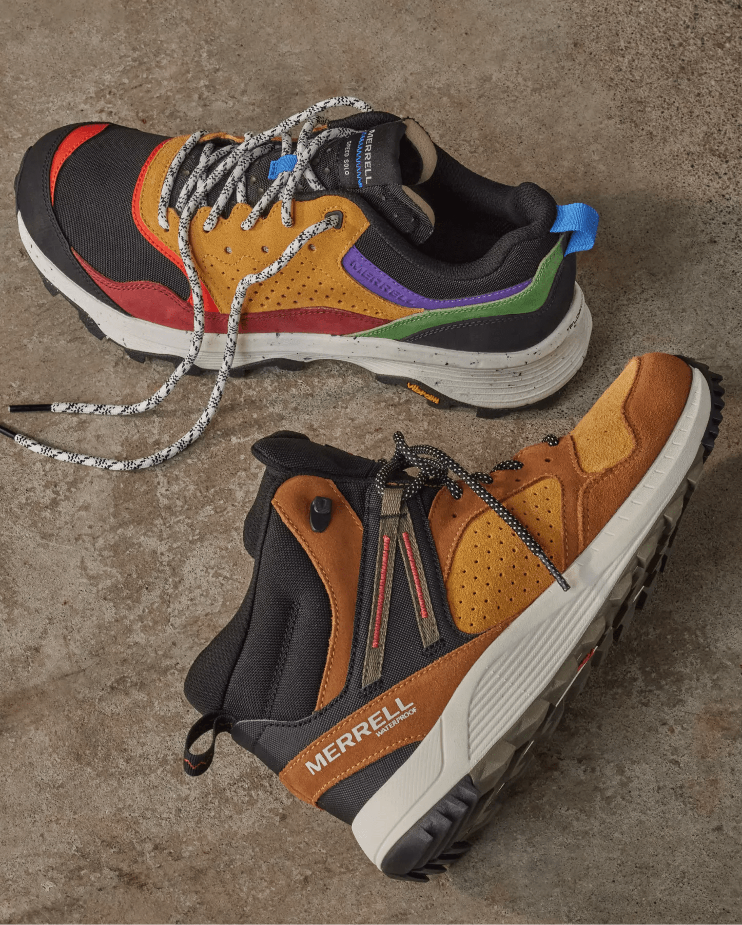 Two hiking shoes on outdoor terrain