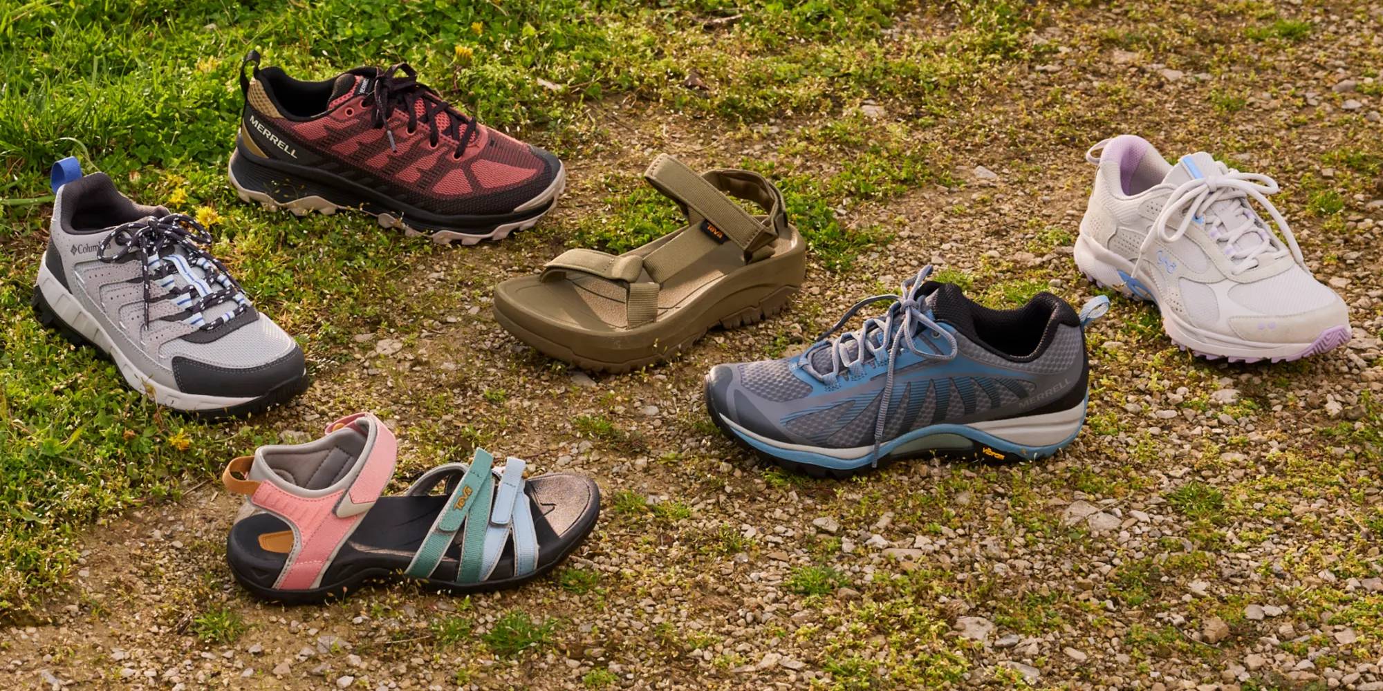 Various types of hiking shoes and sandals on outdoor terrain