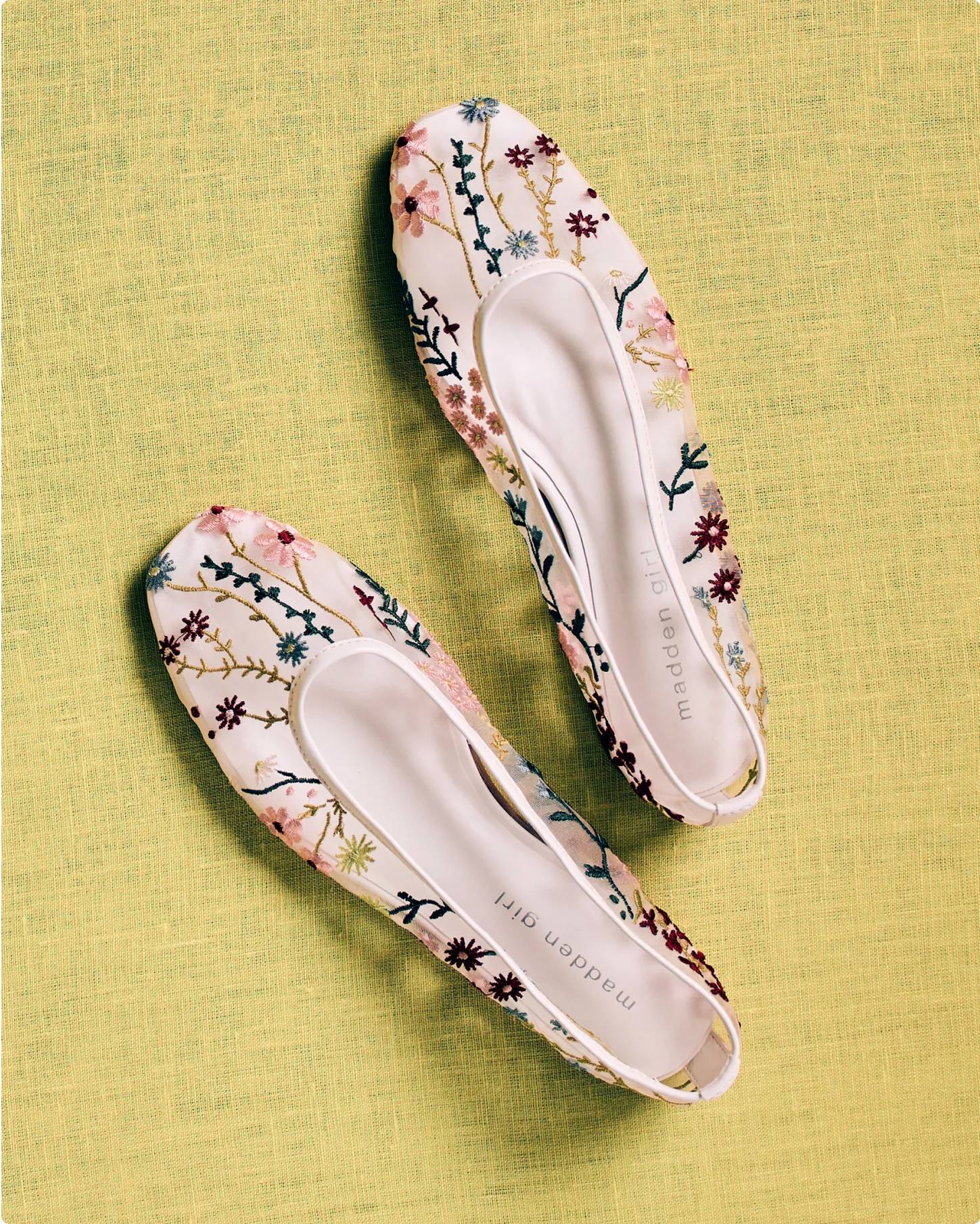 Featuring a pair of floral flats.