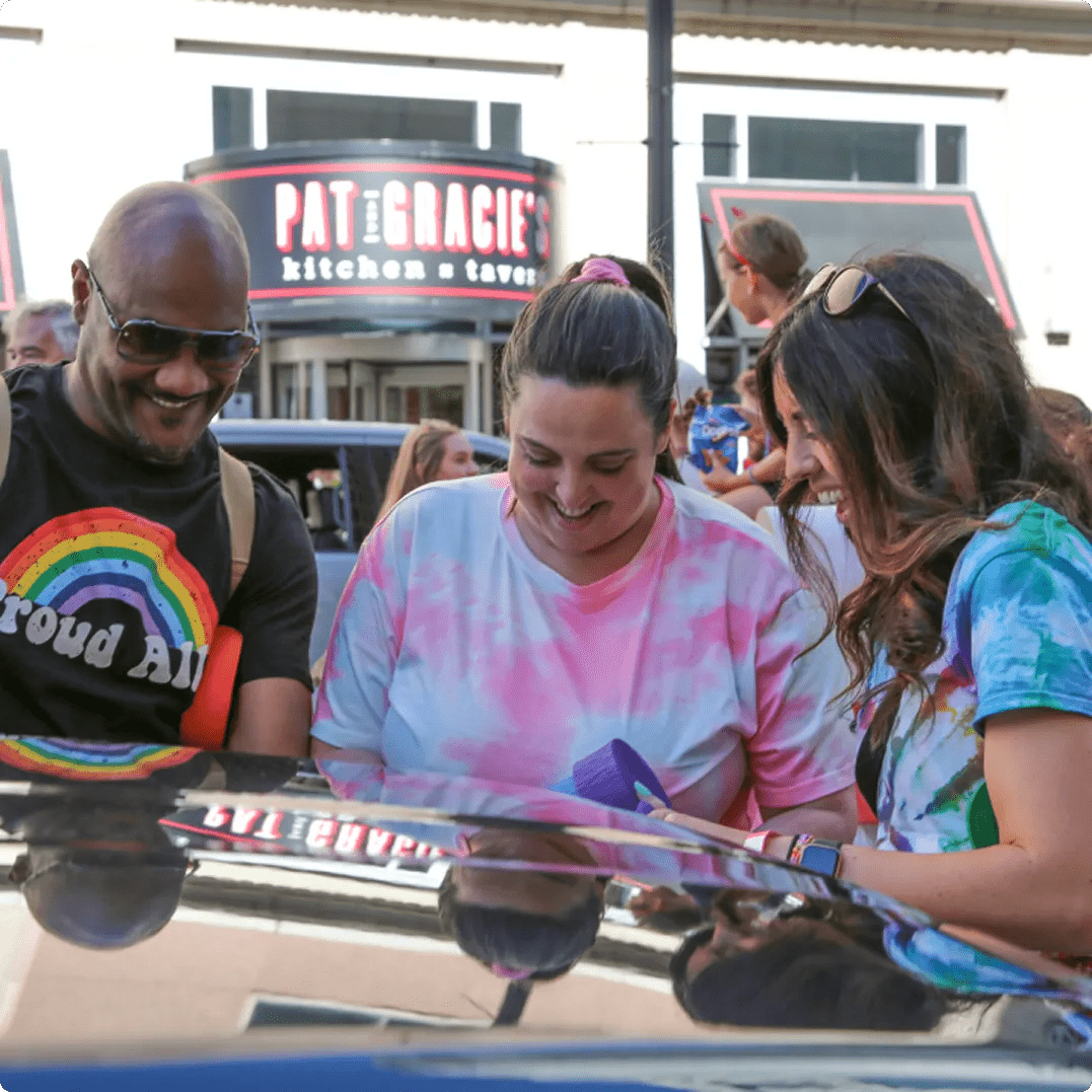 Featuring DSW employees smiling at the Columbus Pride Parade.