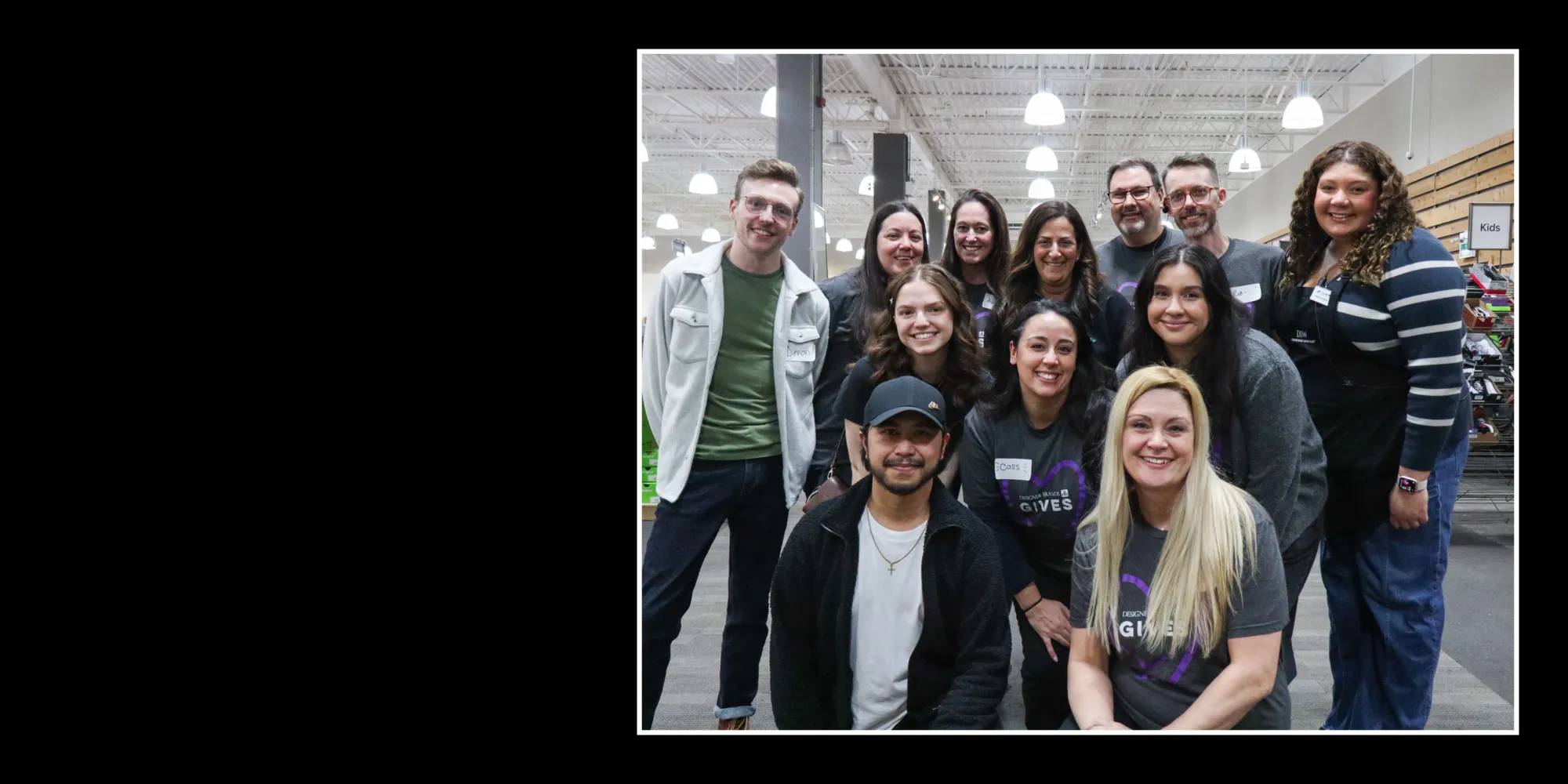 Featuring a group of DSW team members huddled together for photo.