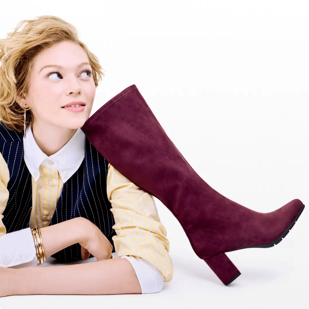 Featuring a model with a bordeaux suede boot