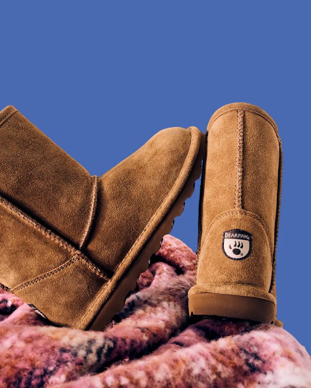 Featuring a model touching navy Nike sneakers.