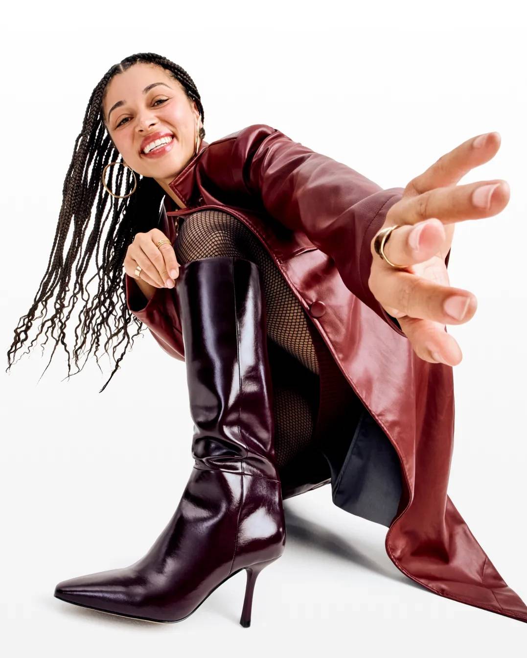 A person wearing tall heeled boots.