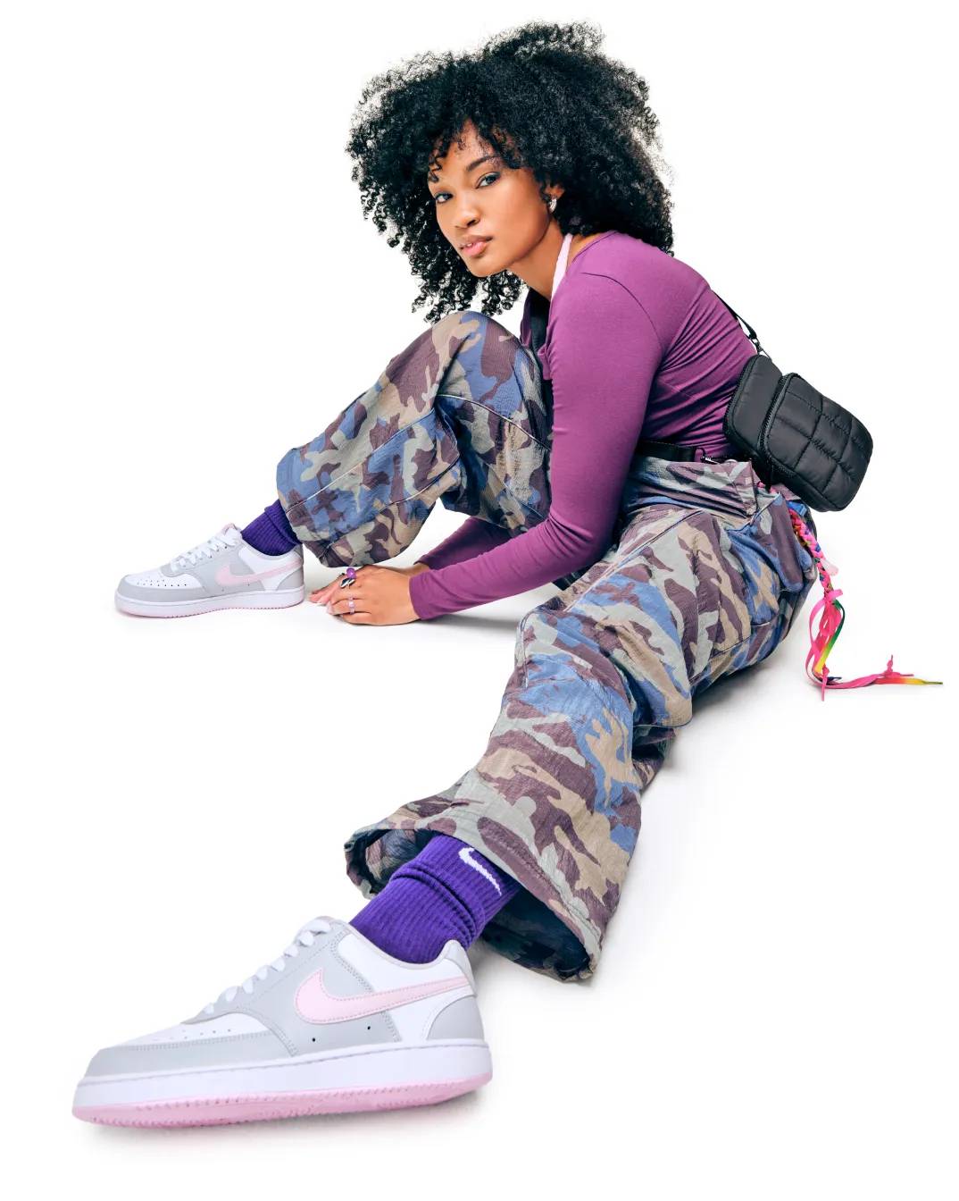 Featuring a model in nike court sneakers.