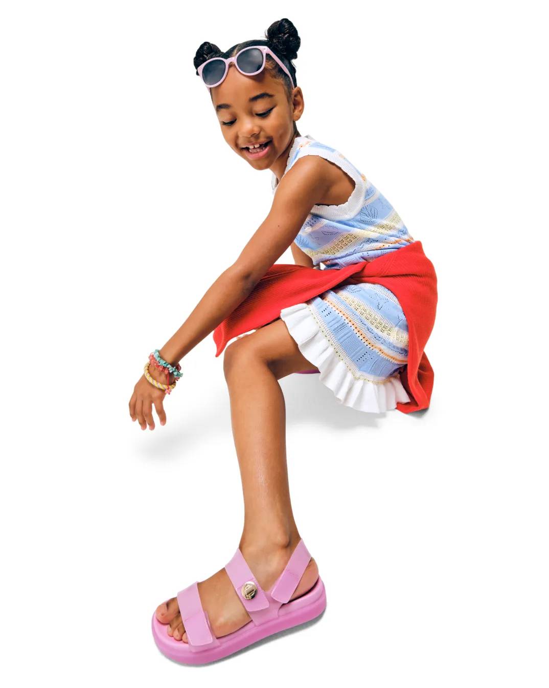 Featuring a model wearing kids sandals.