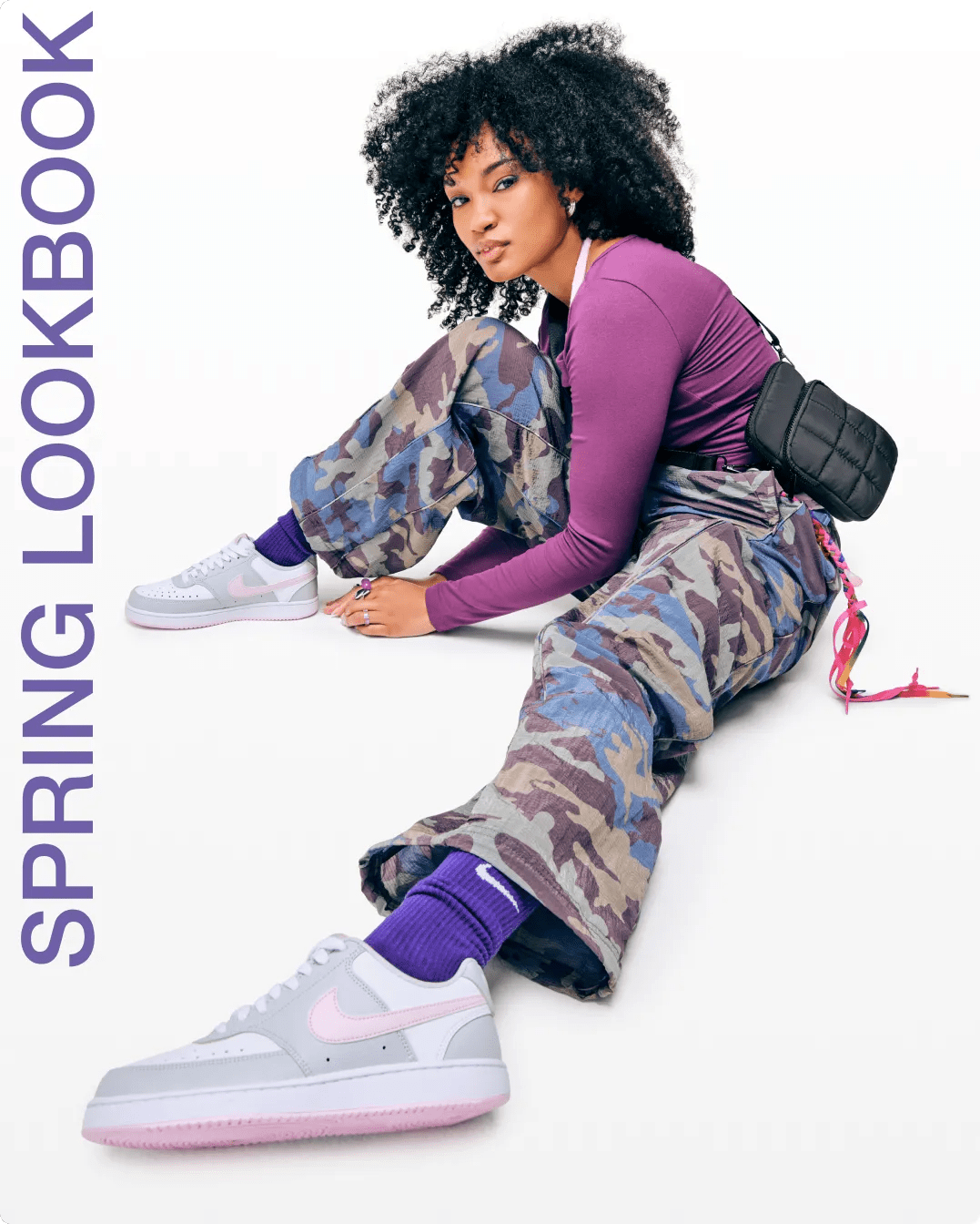 Featuring a woman wearing grey and pink Nike court sneakers.