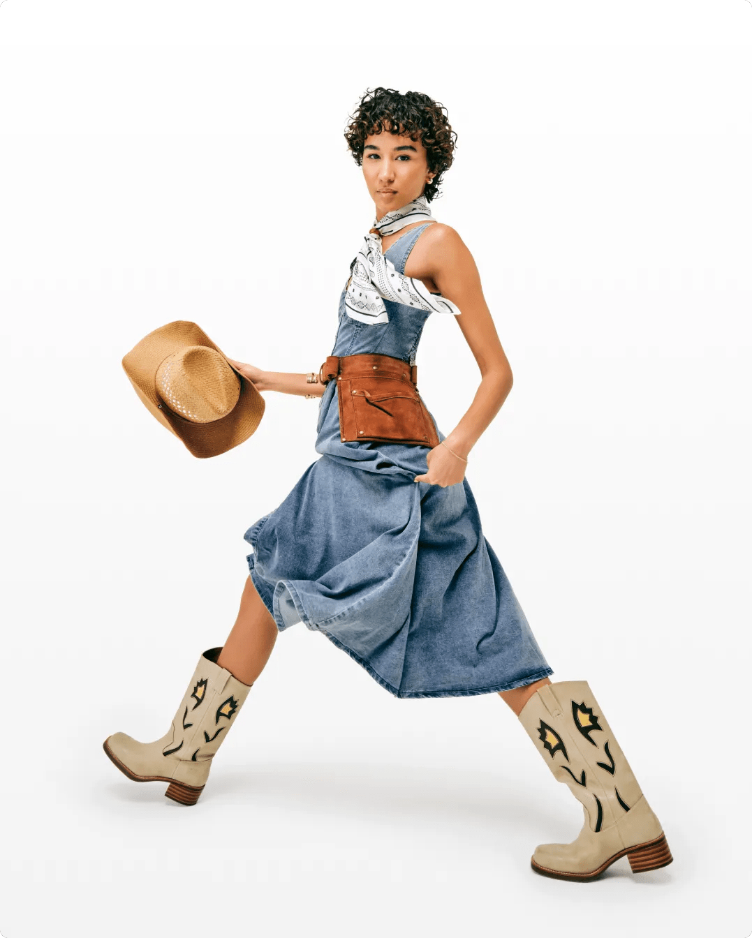 Featuring a woman wearing cowboy boots, ready to go to a concert.