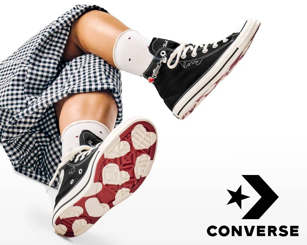Featuring a converse sneaker with hearts on the bottom