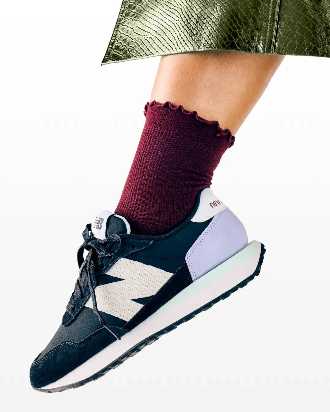 Featuring a model in a New Balance sneaker