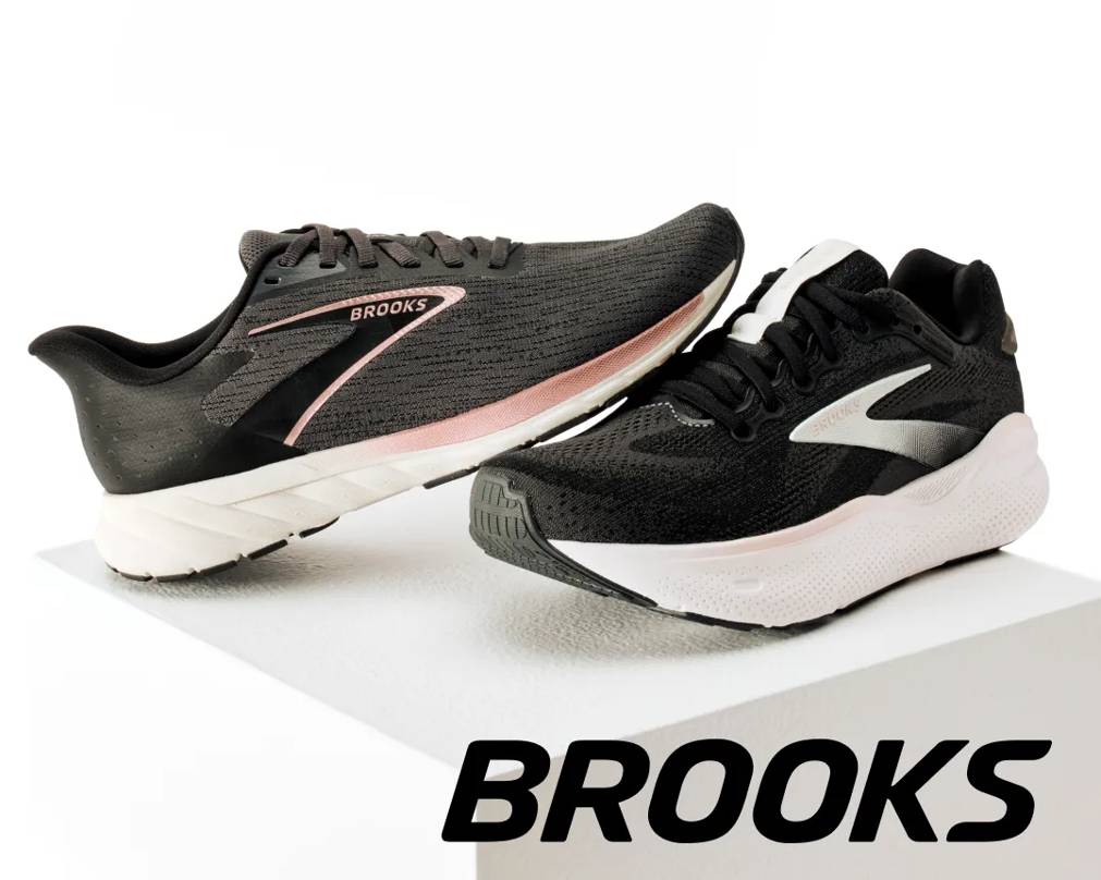 Featuring a women's black and pink Brooks sneaker
