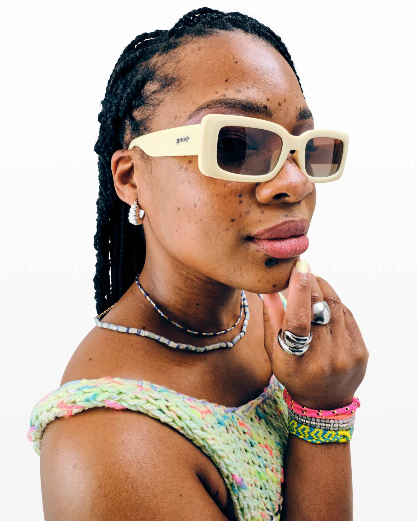 Featuring a model wearing yellow goodr sunglasses.
