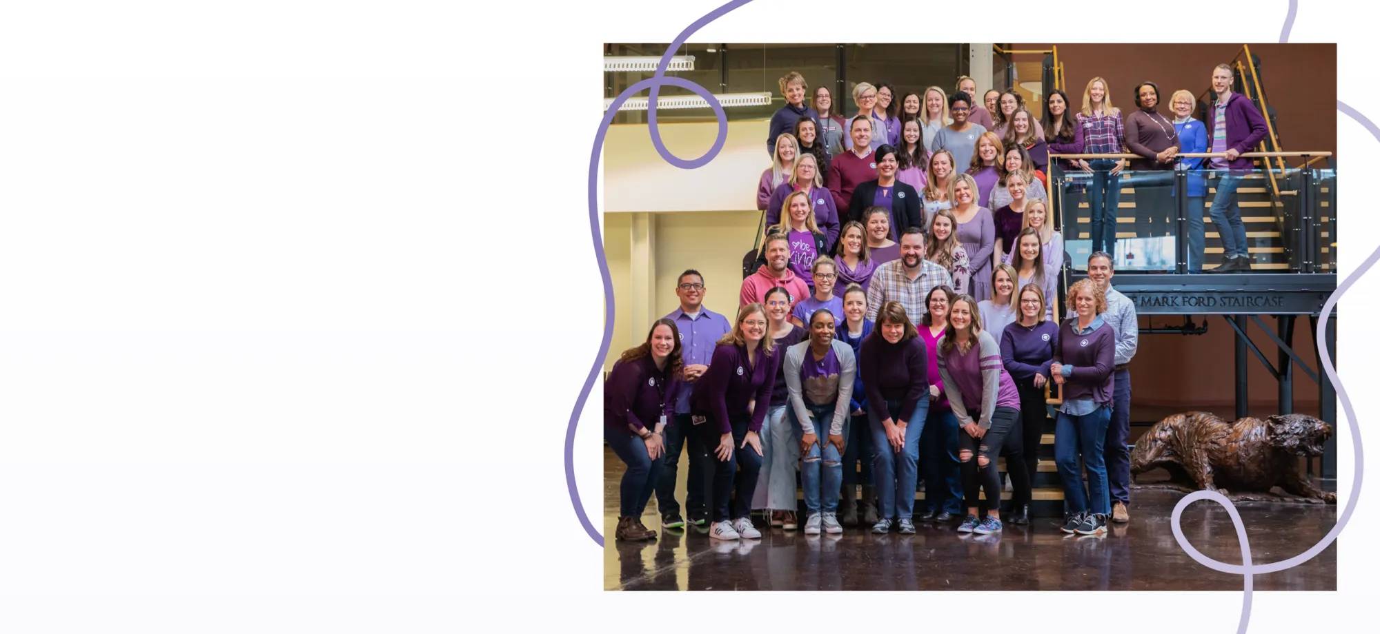 Featuring a ground of DSW associates all wearing purple.