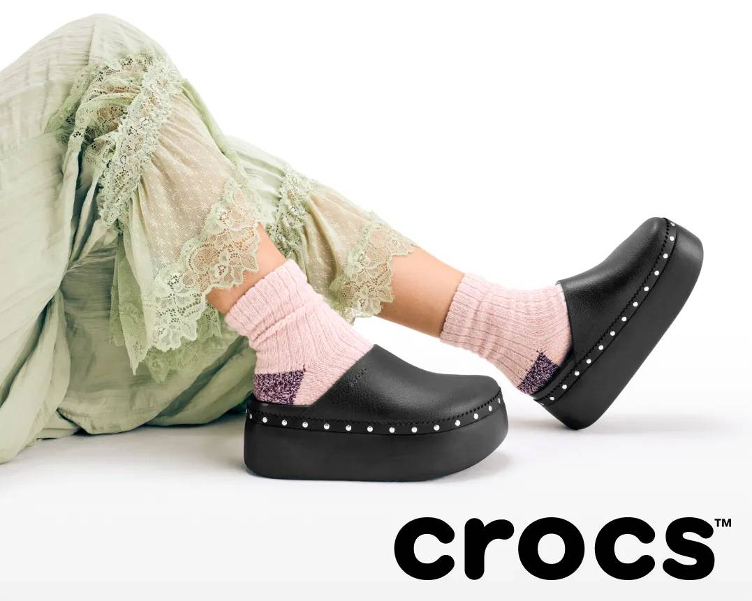 feating black croc mules with studs.