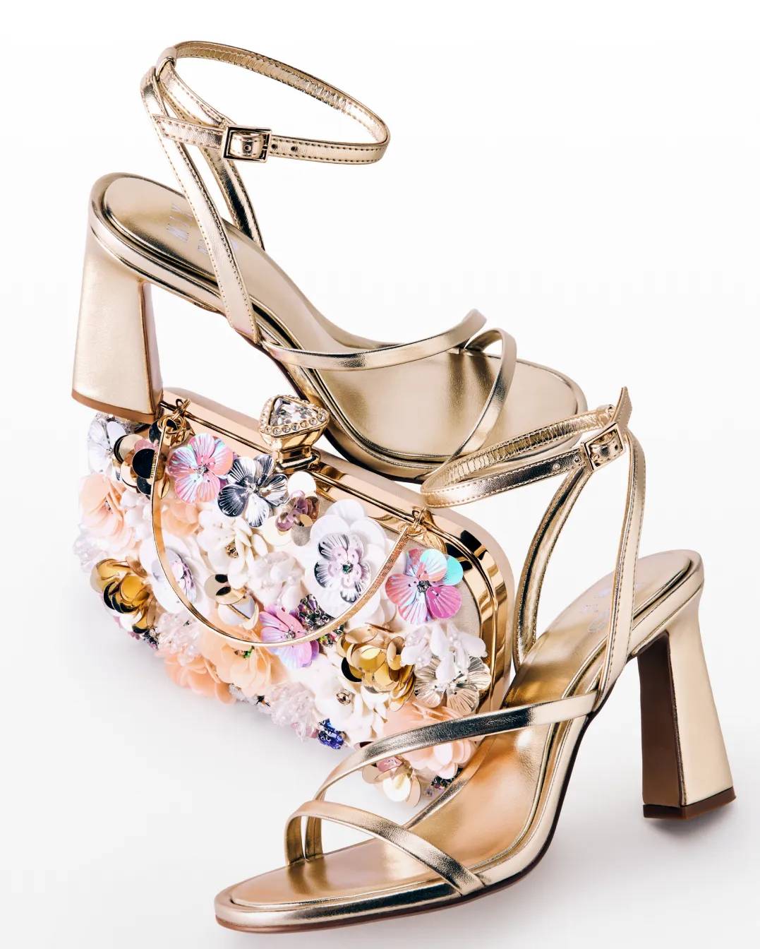 Featuring gold scrappy heels and a flower clutch.