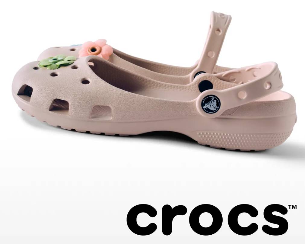 feating a kids' slip on from crocs and the crocs brand logo