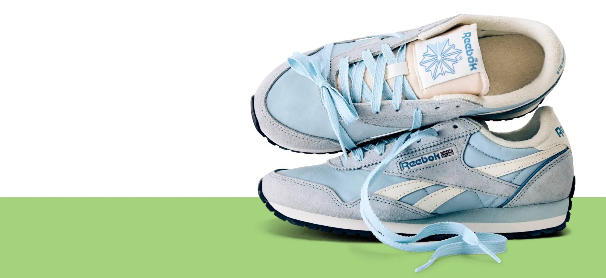 Featuring a light blue low-profile sneaker from Reebok.