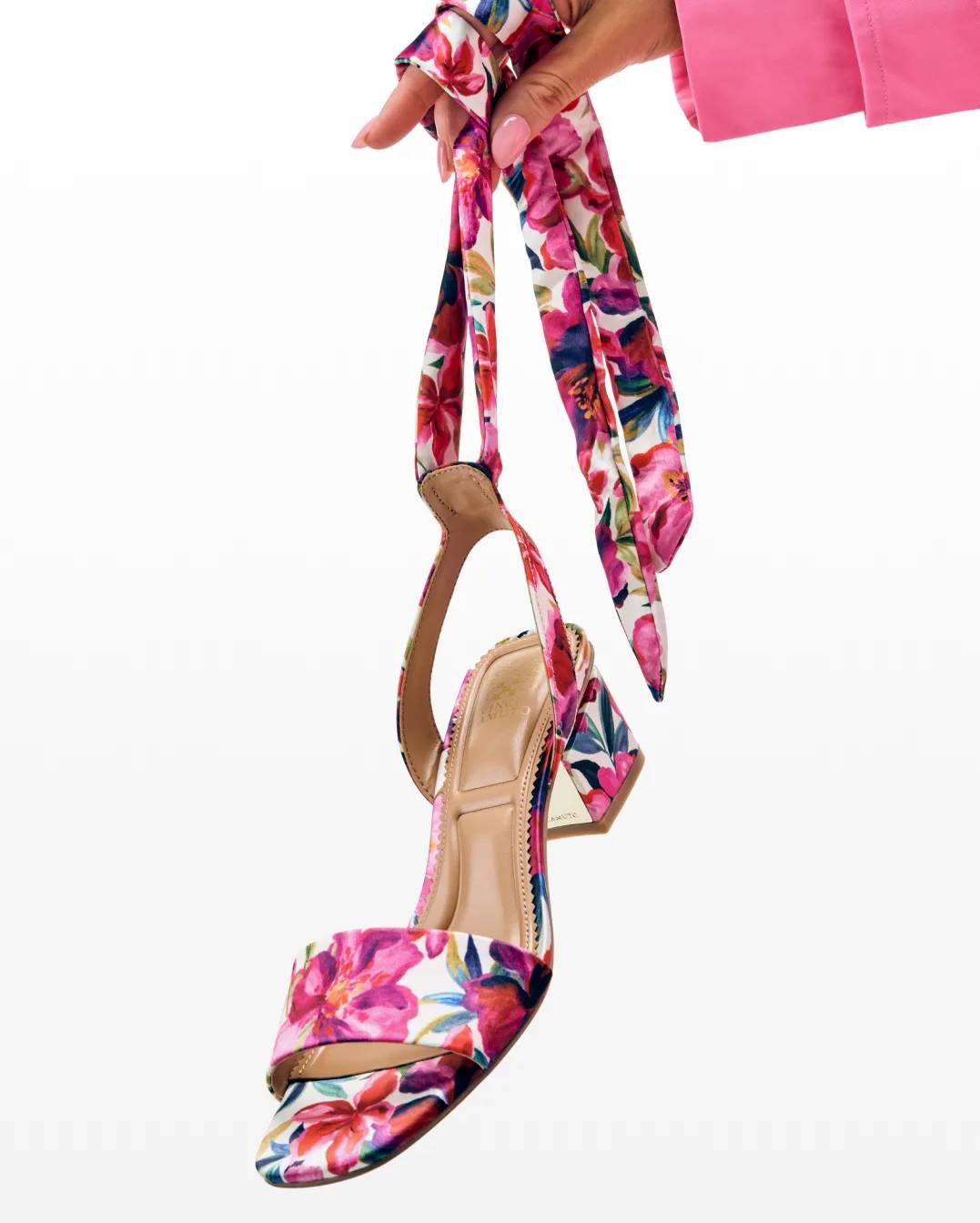 Featuring low-heel block heels with a tie detail ankle strap and a floral design.