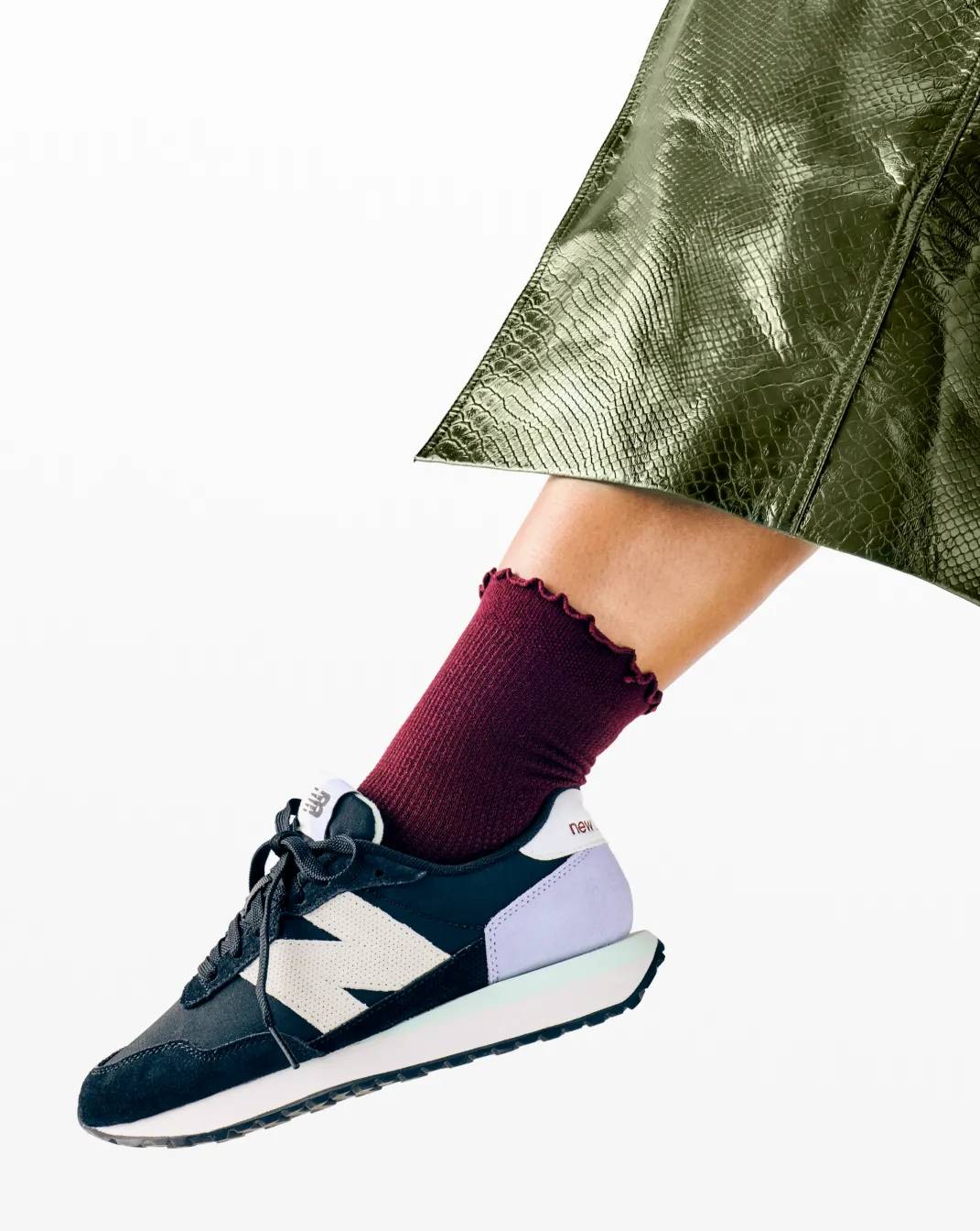 Featuring a skirt & New Balance Sneakers