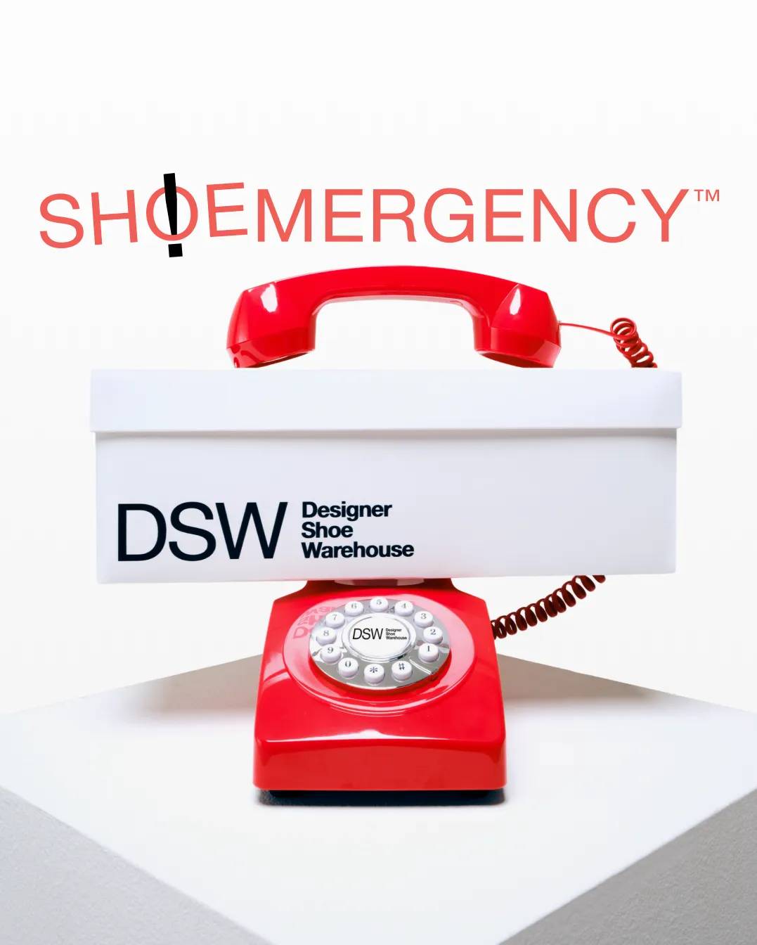Featuring a telephone and a DSW shoebox.