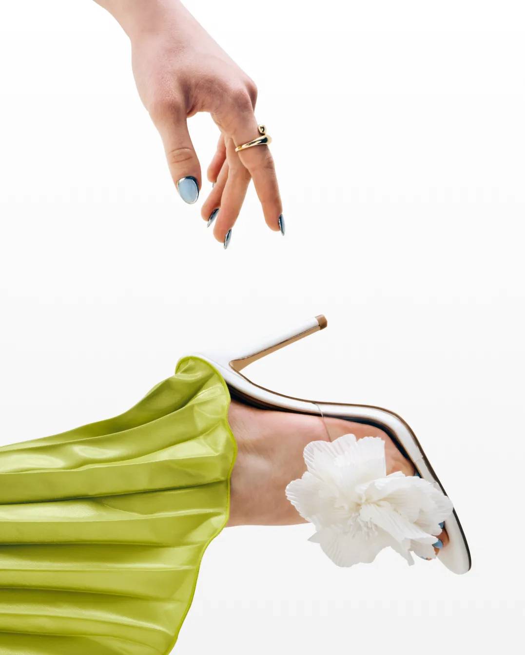 Featuring a woman in a yellow dress showing off her floral heels.