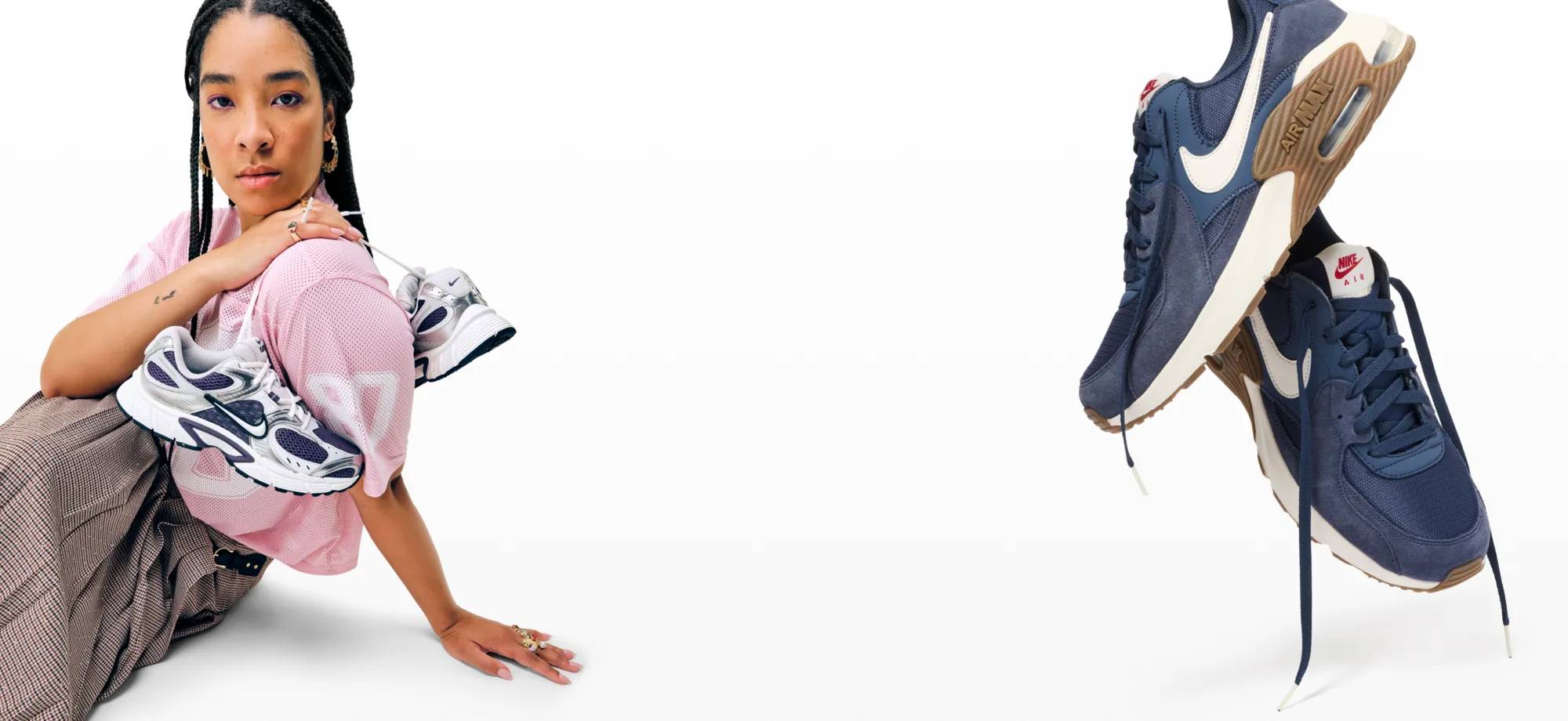 Featuring a woman holding a pair of Nike sneakers.