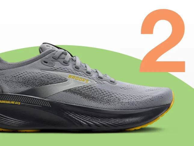 Featuring a grey, black and yellow Brooks running shoe.