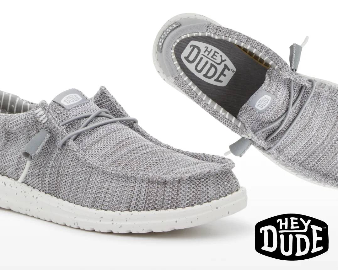 Featuring a grey and white slip on from HeyDude.