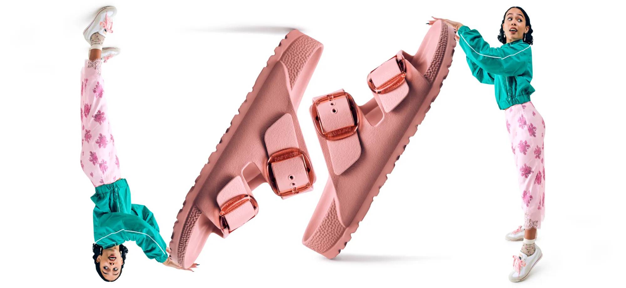 Women in a colorful summer outfit holding a giant pink Birkenstock sandal.