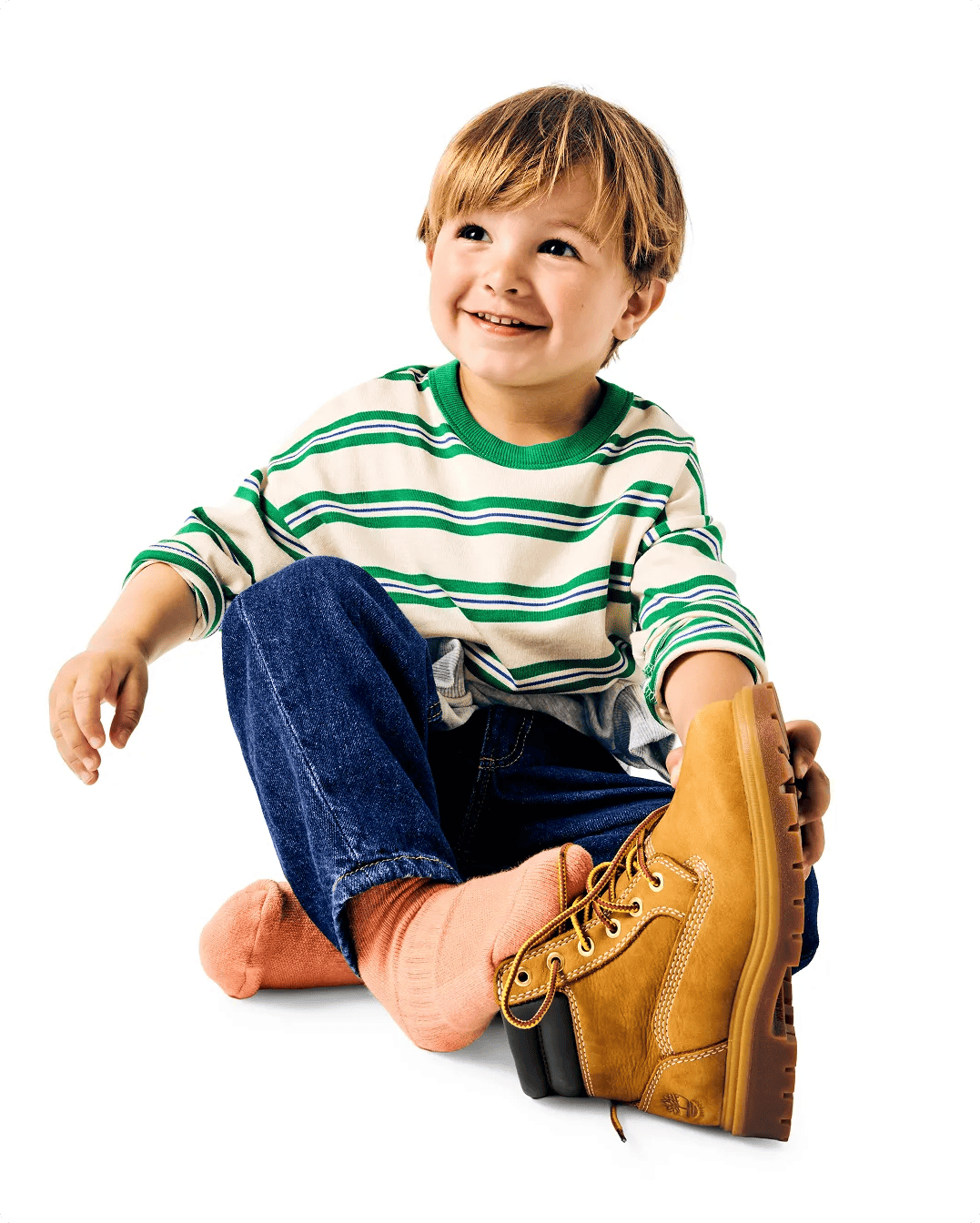 Featuring a model holding kids' Timberland boots.
